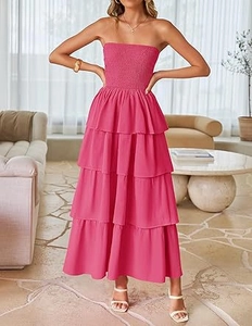 Detail of rose pink strapless dress showing tiered ruffle layers and smocked bodice texture