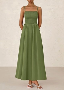 Close-up of olive green maxi dress featuring smocked bodice and thin spaghetti straps