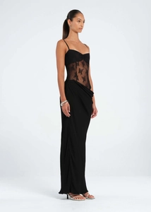 Detail of the sheer lace bodice panel and ruched waist on this slim black fishtail dress