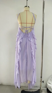 Detailed back view of a lavender chiffon halter dress with cross-straps and ruffles