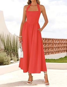 Detailed view of elegant red halter neck dress with side pockets and A-line silhouette