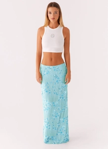 Detail of light blue mesh skirt with exquisite floral beadwork and sequin embroidery