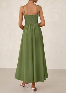 Close-up of olive green maxi dress featuring honeycomb elastic smocking on the back bodice