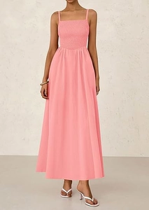 Detail of pink smocked bodice and spaghetti straps on a casual summer midi dress