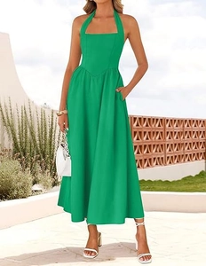 Detailed view of emerald green halter neck maxi dress with high waist and side pockets