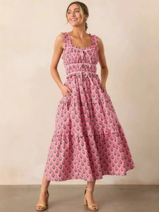 Elegant French floral maxi dress in pink with ruffled straps and decorative bow ties
