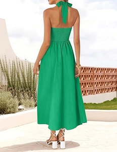 Detail view of the halter neck tie and back smocking on the vibrant green maxi dress