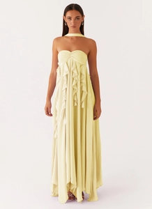 Detailed view of pale yellow chiffon maxi dress with layered ruffles and halter neck tie