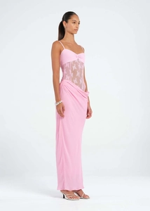 Close-up of pink lace stitching and delicate floral embroidery on a slim fishcut dress