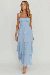 Detail of light blue tiered ruffle dress with pleated square neckline and soft fabric