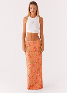 Detail of orange bohemian long skirt with floral sequins and beaded embroidery