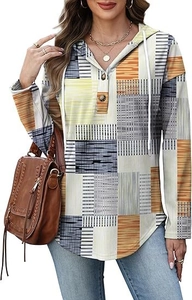 Detail of V-neck buttoned hoodie with orange and grey geometric plaid patchwork patterns