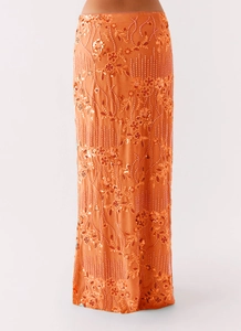 Detailed embroidery of orange sequins and floral beads on the high waist long skirt