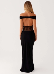 Detail of the backless black lace patchwork design on a slim fit evening maxi dress