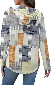Rear view of a hooded pullover for women with abstract geometric prints and a curved hem