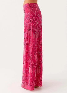 Detail of rose red sequin embroidery and beadwork on a slim fit maxi skirt