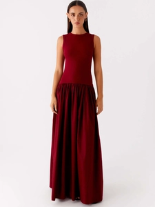 Sleeveless burgundy maxi dress with knit bodice and pleated skirt on white background