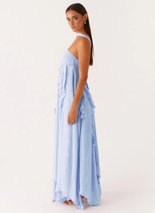 Detail of light blue halter neck maxi dress with cascading ruffles and chiffon texture