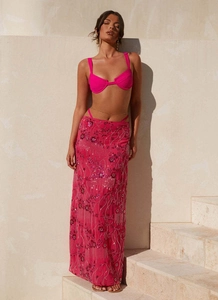 Detail of pink sequin maxi skirt with floral embroidery and mesh fabric for summer beach wear