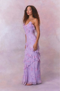 Detail of purple floral chiffon maxi dress with ruffled hem and backless design