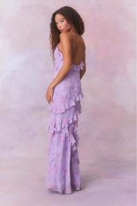 Detail of floral chiffon dress showing layered ruffles and backless design in purple