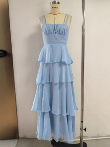 Light blue tiered ruffled maxi dress with spaghetti straps and pleated bust detail