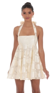 Detail view of the elegant halter backless dress featuring a rose jacquard silk pattern