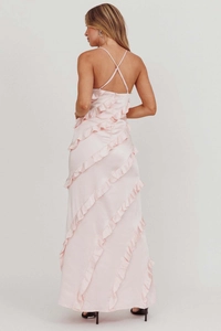 Detail of light pink satin dress featuring tiered ruffles and cross backless design