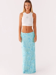 Elegant white ribbed crop top with blue sequin embroidered maxi skirt for summer