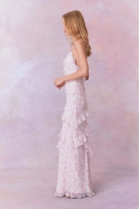Detail of pink floral chiffon maxi dress with elegant tiered ruffle hem for women