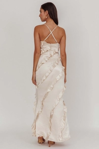 Detail view of champagne satin backless dress showing crossover straps and ruffled layers