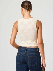 Haut sans manches en dentelle crème avec col à volants et broderie florale élégante