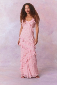 Detail of delicate pink floral chiffon dress showing layered ruffles and soft texture