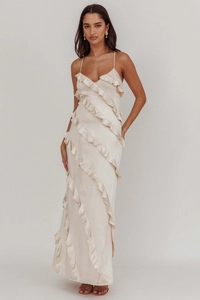 Detail of champagne satin maxi dress featuring slim straps and layered ruffle hem