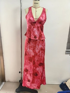 Detail of pink marble tie-dye two-piece set with lace V-neck camisole and satin maxi skirt