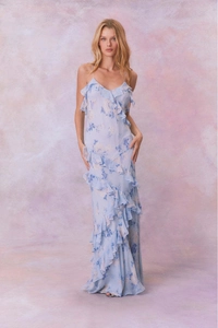Detail of light blue floral chiffon dress showing tiered ruffles and flowing fabric