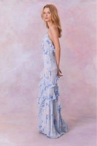 Detail of light blue floral maxi dress featuring ruffles and open back chiffon design