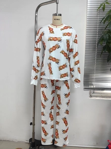 Detail view of the soft ribbed fabric and festive pumpkin print on the pajama set
