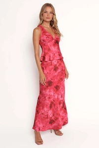 Detail of pink marble print satin dress featuring lace trim and a V-neckline finish
