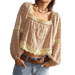 Detailed view of bohemian plaid blouse with crochet lace trim and square neckline