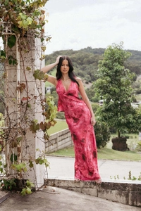 Detailed view of the pink tie-dye halter top and flowing satin maxi skirt set