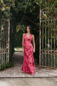 Detail of elegant two-piece pink tie-dye halter top and maxi skirt set for summer