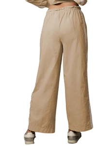 Rear view of beige wide-leg lounge pants with white side stripes and lace-up waistband