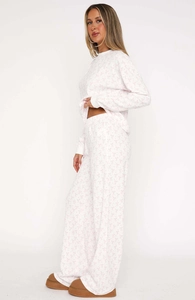 Detail of pink bow print waffle fabric on women's long sleeve loungewear pajamas set