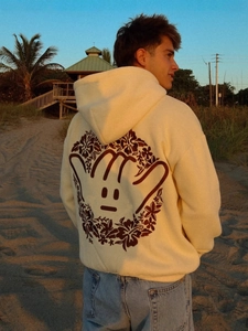 Cream drop shoulder hoodie with Chasing Sunsets embroidery on back at beach sunset
