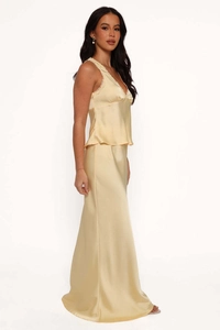 Detail of champagne satin two-piece set featuring lace patchwork and draped maxi skirt