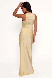 Detailed view of champagne satin fabric with delicate lace trim on the sleeveless top