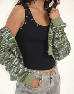 Detail of black ribbed tank top with metallic eyelets and camouflage cropped hoodie jacket