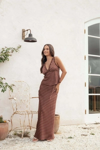 Detail of coffee brown polka dot two-piece set featuring lace V-neck top and long skirt