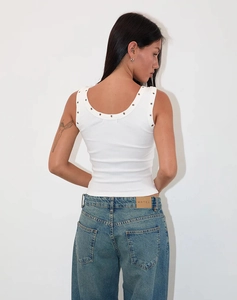 Detailed back view of white ribbed tank top with silver metal eyelets and a deep round neck